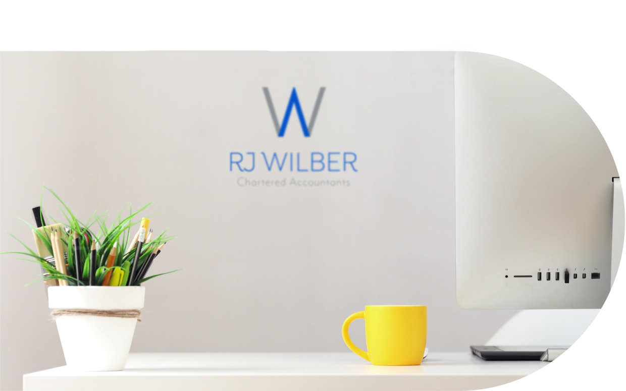 RJ Wilber Chartered Accountants office scene with computer 